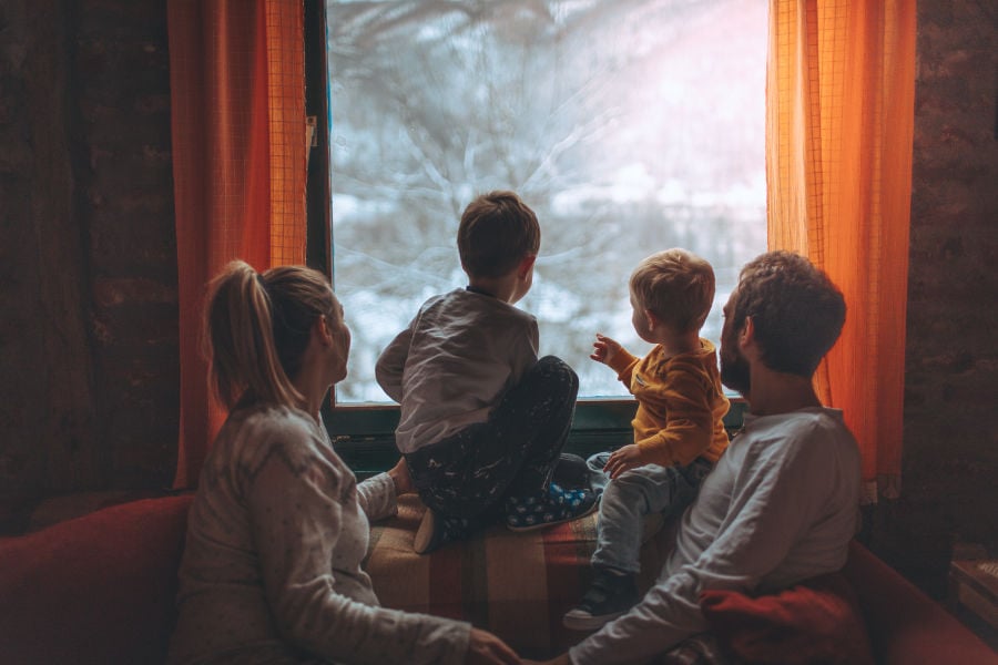 family looking out window