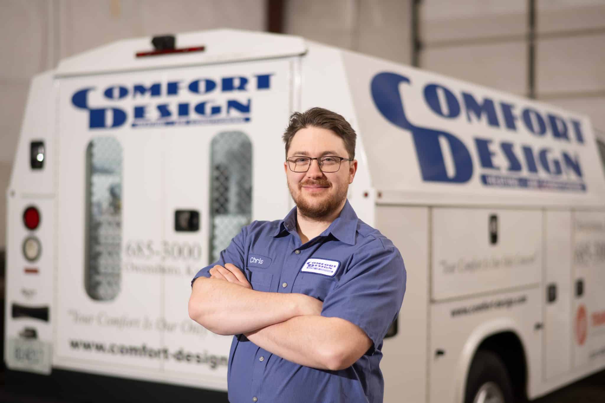 man standing in front of Comfort Design work truck