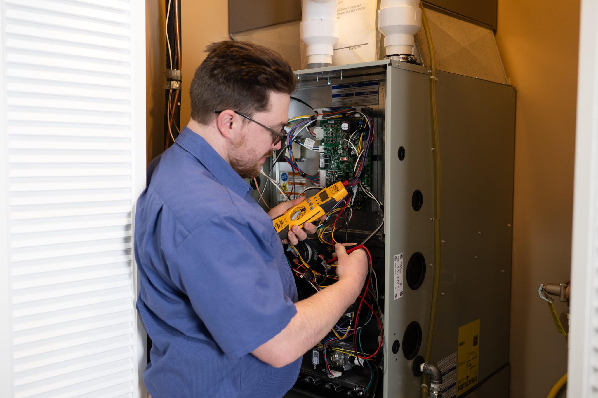 man working on a furnace