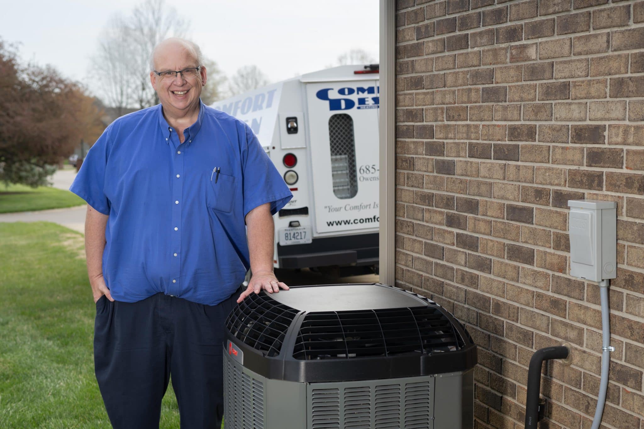 man standing next to AC